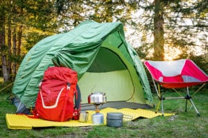 Equipment for camping and hiking in the mountains in summer.