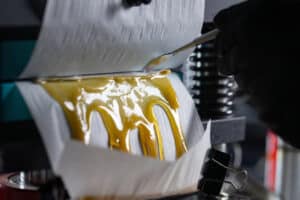 Shot of the process for making live rosin from dry hash and cannabis trichomes. Shot inside of a cannabis processing laboratory in Oregon, USA.
